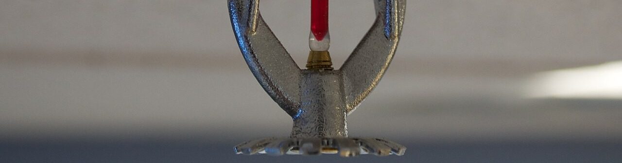 Close up of ceiling mounted fire sprinkler system nozzle